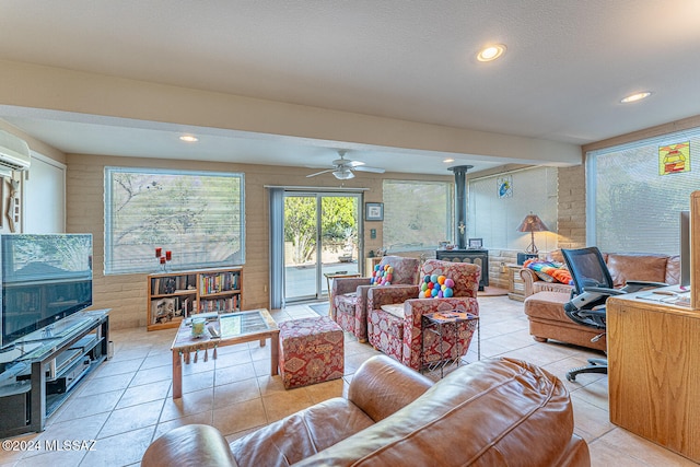 tiled living room with ceiling fan