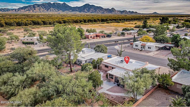 birds eye view of property with a mountain view