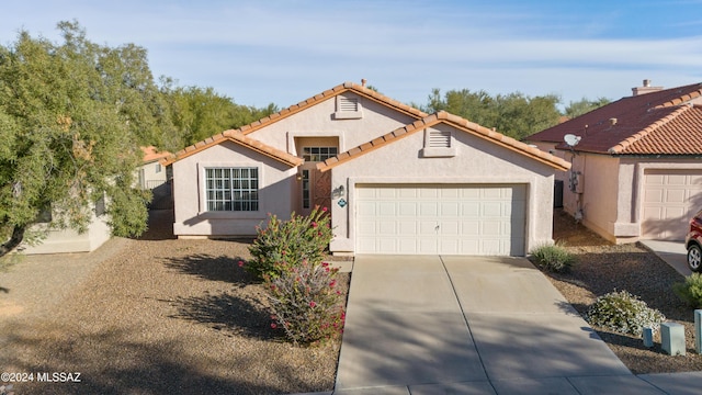 view of front of property with a garage