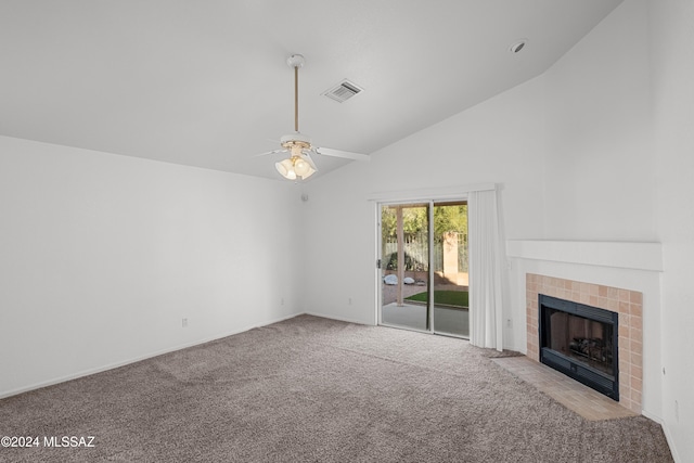 unfurnished living room with ceiling fan, light colored carpet, high vaulted ceiling, and a tiled fireplace