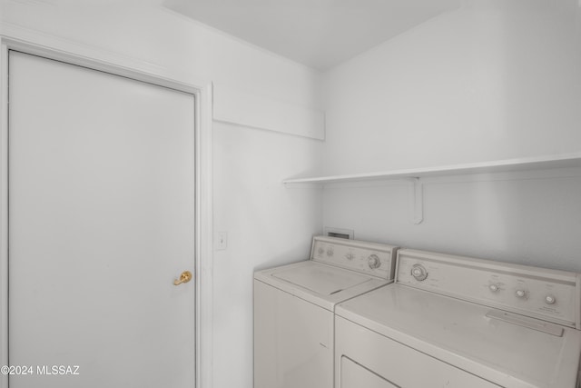 laundry area with independent washer and dryer