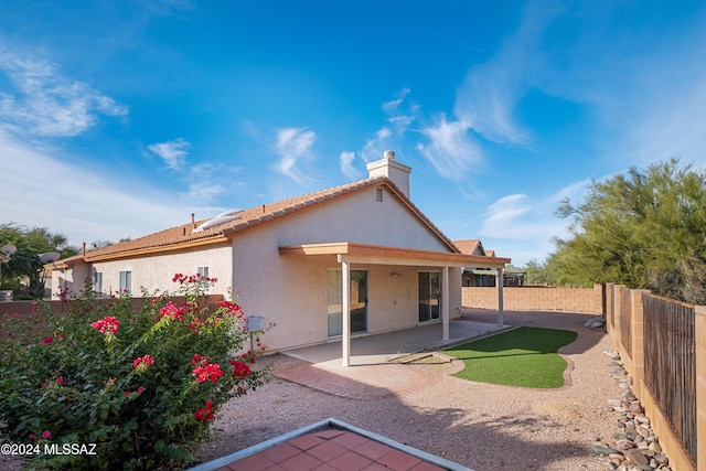 rear view of property with a patio area