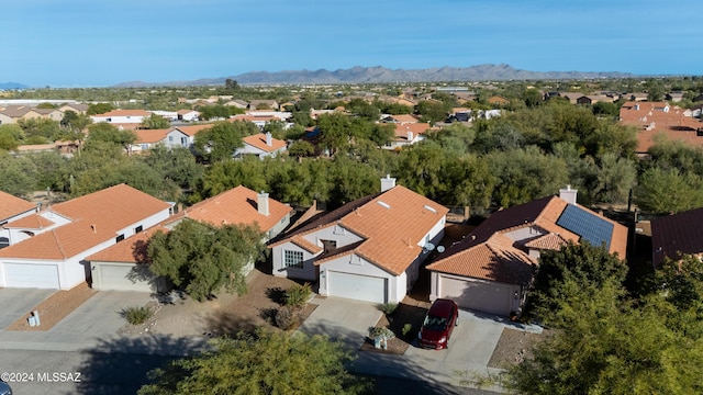 birds eye view of property featuring a mountain view