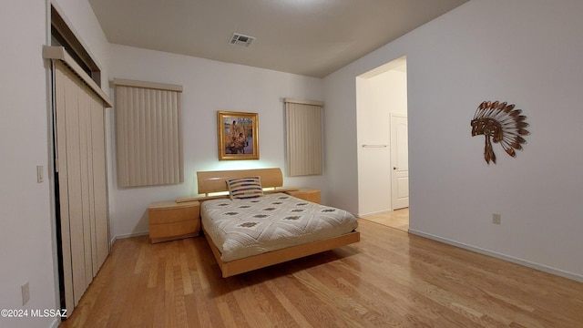 bedroom with light hardwood / wood-style floors