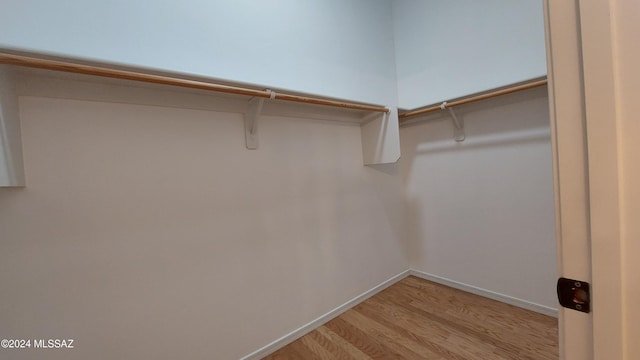 walk in closet featuring light wood-type flooring