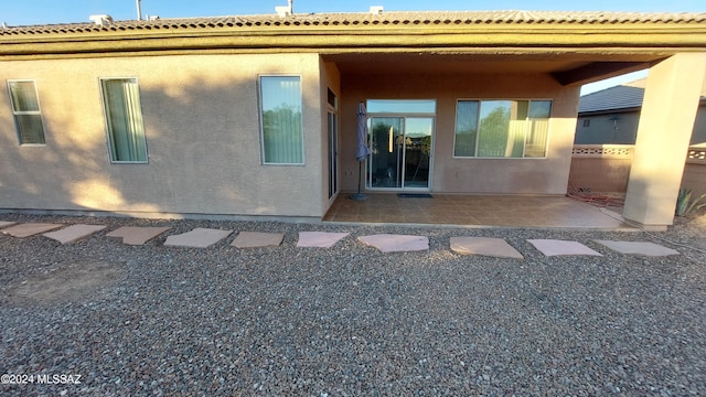 rear view of property featuring a patio area