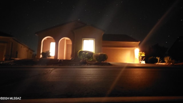 view of front of property with a garage