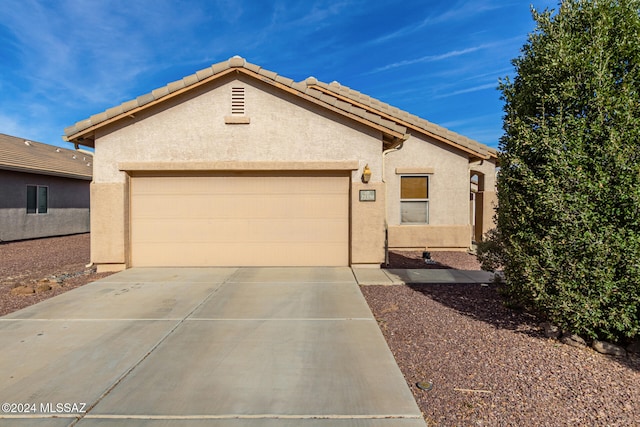 view of front of property with a garage