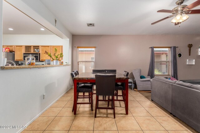 21330 E Reunion Rd, Red Rock, AZ 85145 - dining area featuring light tile patterned floors, a ceiling fan, and recessed lighting