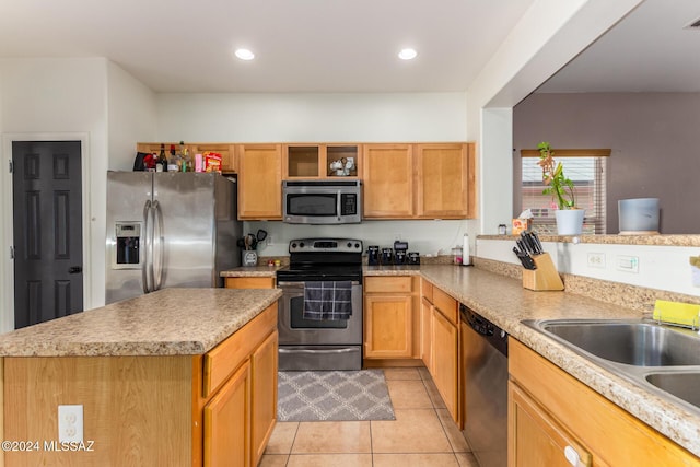 21330 E Reunion Rd, Red Rock, AZ 85145 - kitchen with stainless steel appliances, light tile patterned floors, a kitchen island, open shelves, and a sink