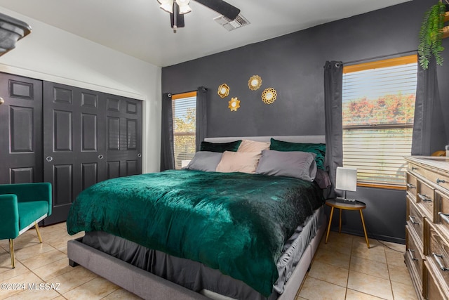 21330 E Reunion Rd, Red Rock, AZ 85145 - bedroom with light tile patterned floors, a closet, and a ceiling fan