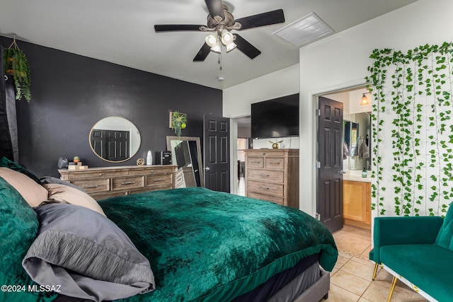 21330 E Reunion Rd, Red Rock, AZ 85145 - bedroom featuring light tile patterned floors, connected bathroom, and a ceiling fan