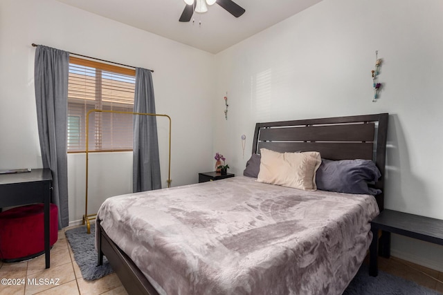 21330 E Reunion Rd, Red Rock, AZ 85145 - bedroom with tile patterned flooring, a ceiling fan, and baseboards