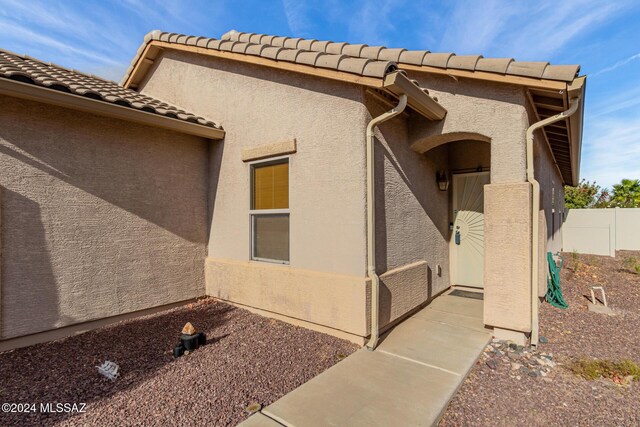 21330 E Reunion Rd, Red Rock, AZ 85145 - view of home's exterior with a tiled roof and stucco siding