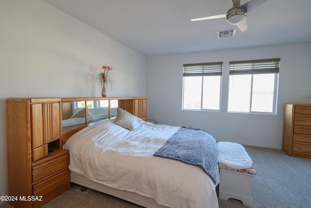 bedroom with ceiling fan and carpet floors