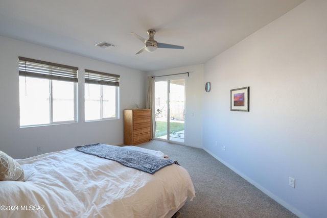 bedroom with access to exterior, carpet flooring, and ceiling fan