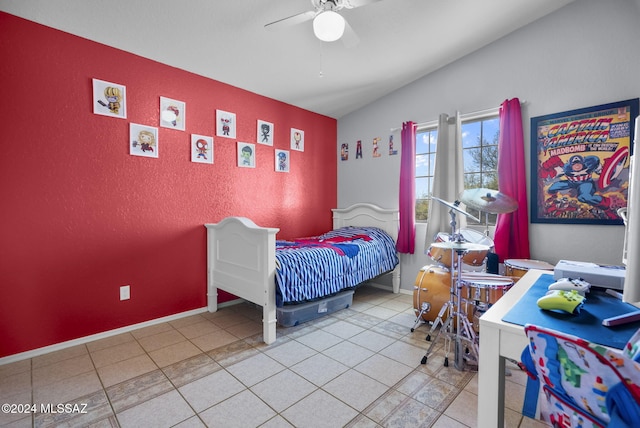 bedroom featuring ceiling fan, lofted ceiling, and light tile patterned floors