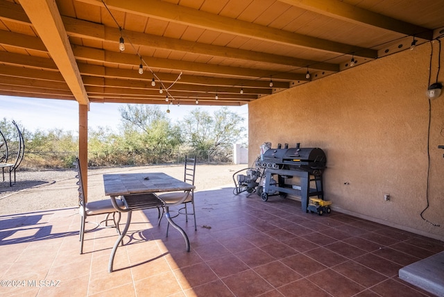 view of patio with a grill