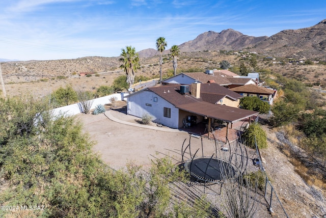 birds eye view of property featuring a mountain view