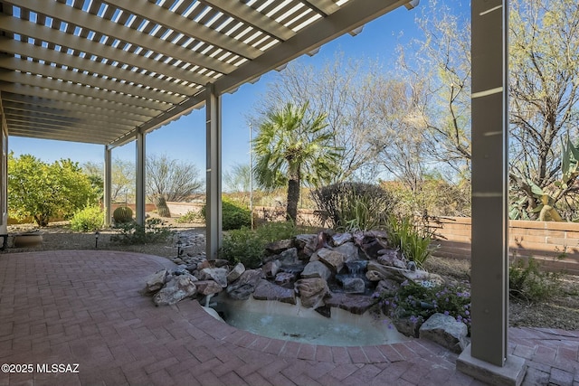 view of patio / terrace featuring fence and a pergola