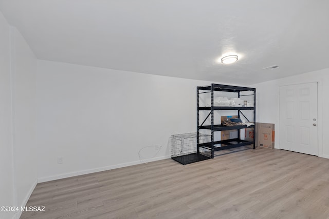 spare room featuring light hardwood / wood-style floors