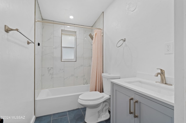 full bathroom featuring shower / bath combo with shower curtain, tile patterned flooring, vanity, and toilet