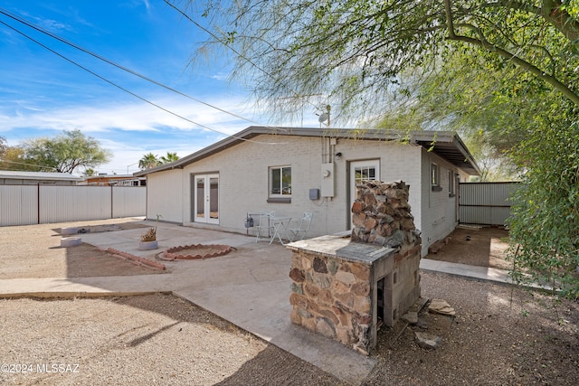 back of house with a patio area and french doors