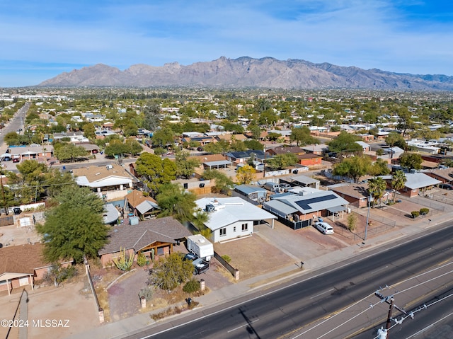 birds eye view of property featuring a mountain view