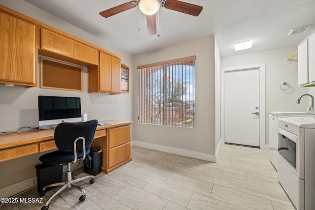 office featuring a ceiling fan, baseboards, visible vents, built in study area, and washer / dryer