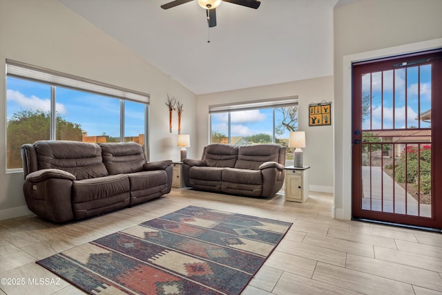 living area with wood tiled floor, high vaulted ceiling, baseboards, and ceiling fan