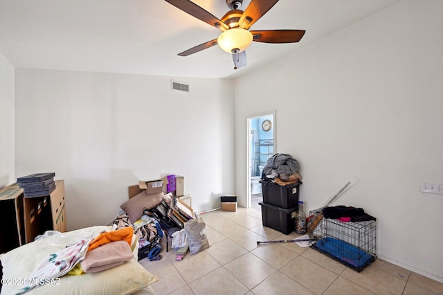 miscellaneous room featuring light tile patterned floors and ceiling fan