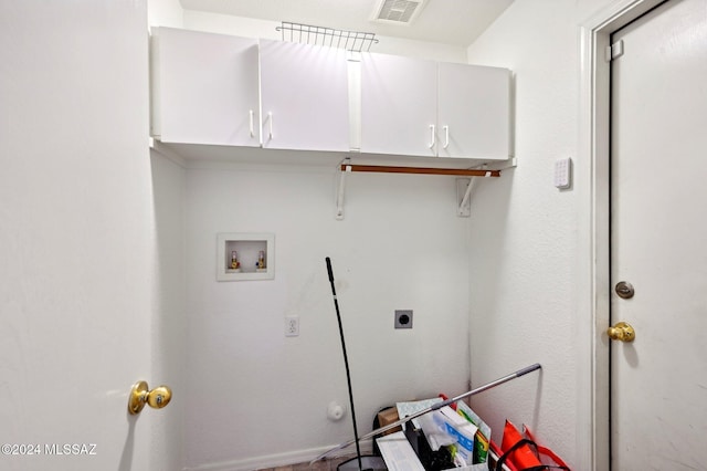 washroom featuring hookup for an electric dryer, washer hookup, and cabinets