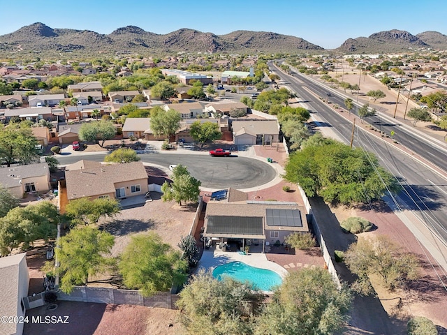 birds eye view of property featuring a mountain view