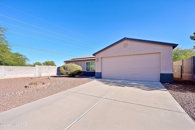 single story home featuring a garage