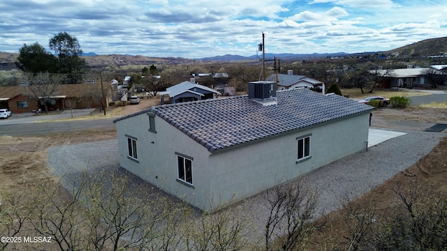 birds eye view of property with a mountain view