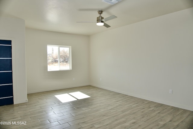 empty room featuring light wood-type flooring and ceiling fan