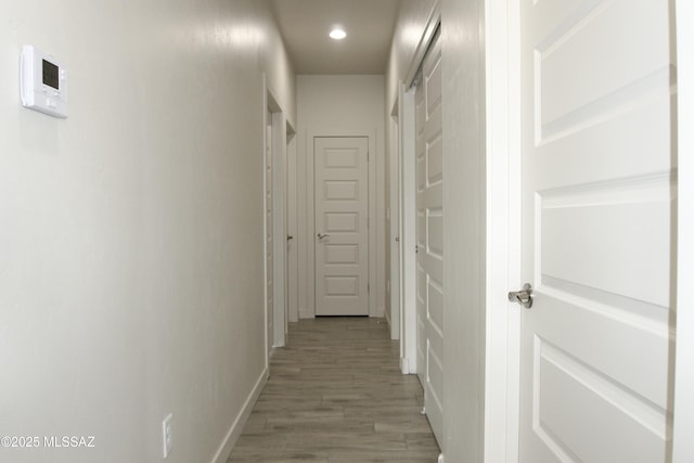 hall with light hardwood / wood-style floors