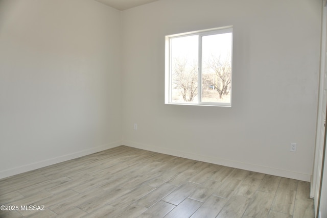 unfurnished room featuring light hardwood / wood-style flooring