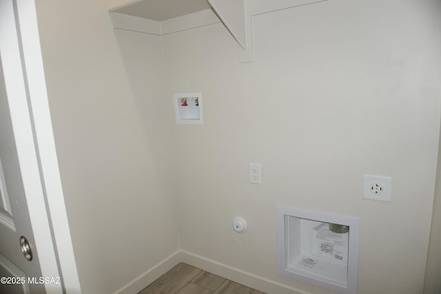 laundry area with hardwood / wood-style flooring, hookup for a gas dryer, washer hookup, and hookup for an electric dryer