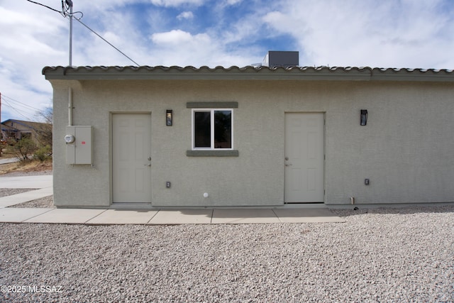 back of property with a patio area