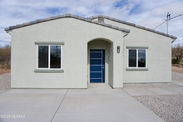 back of property featuring a patio