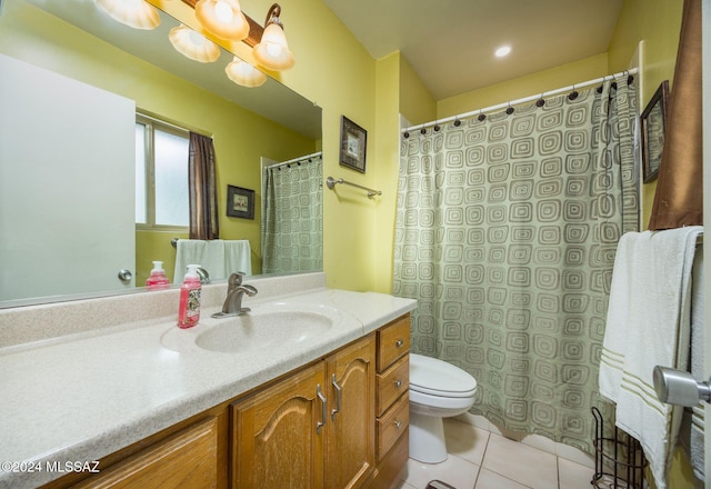 bathroom featuring tile patterned floors, vanity, and toilet