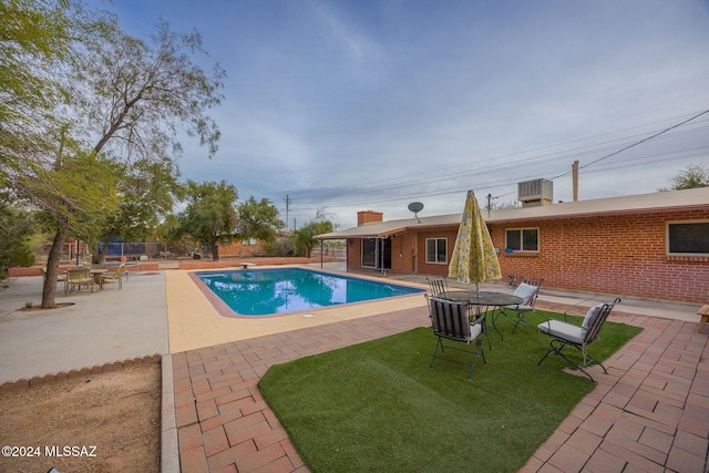 1440 W Roller Coaster Rd, Tucson, AZ 85704 - view of swimming pool with a patio, a lawn, a diving board, and central air condition unit