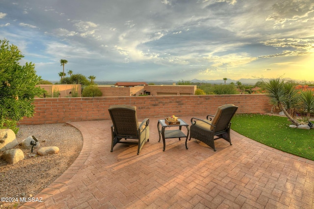 view of patio terrace at dusk