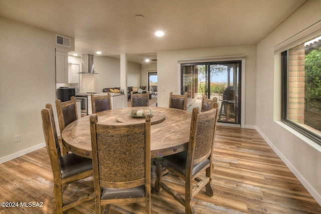 dining room with recessed lighting, visible vents, baseboards, and light wood-style floors