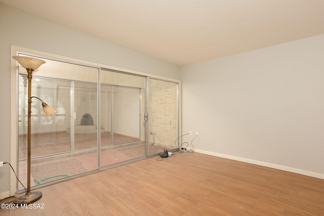 laundry room featuring hardwood / wood-style flooring