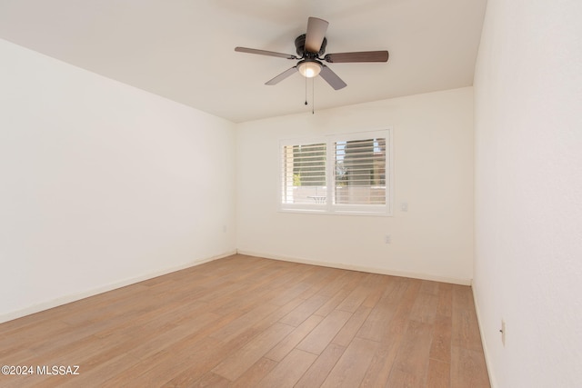 unfurnished room with ceiling fan and light wood-type flooring