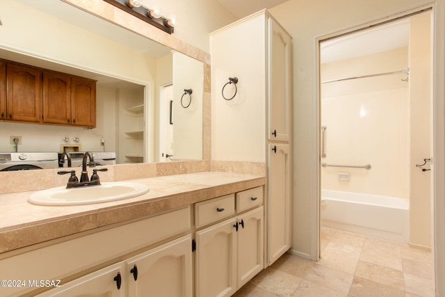 bathroom featuring washer / clothes dryer and vanity