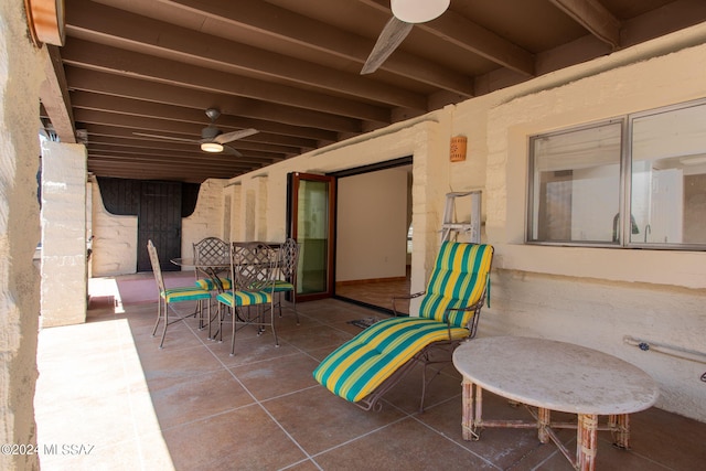 view of patio featuring ceiling fan