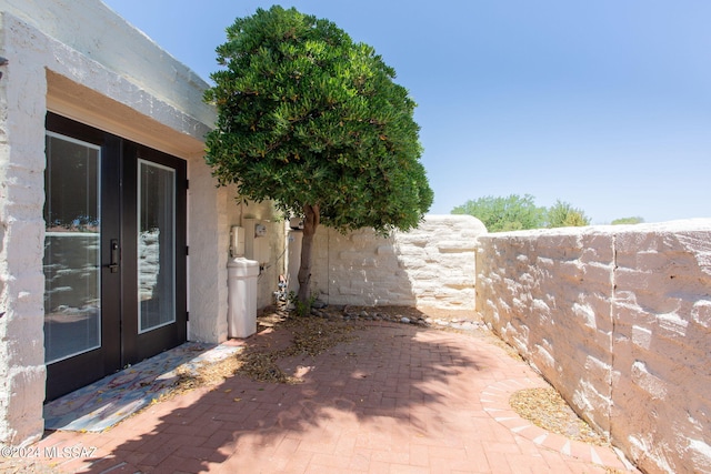 doorway to property featuring a patio area